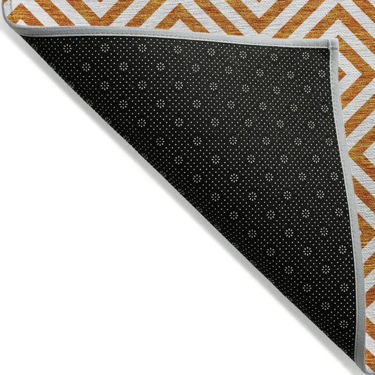 5' X 8' Orange And Ivory Geometric Washable Indoor Outdoor Area Rug
